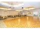 Open ballroom with hardwood dance floor, elegant lighting, and versatile space for various events and activities at 1481 Hyssop Loop, North Port, FL 34289