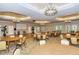 Expansive ballroom with elegant lighting, ample seating, and a projector screen for events and gatherings at 1481 Hyssop Loop, North Port, FL 34289