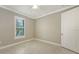Bedroom with large window at 1481 Hyssop Loop, North Port, FL 34289