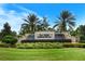 Del Webb Cypress Falls entrance sign with waterfall and green lawn at 1481 Hyssop Loop, North Port, FL 34289