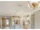 Beautiful open kitchen with island, white cabinets, stainless appliances, and stylish pendant lighting at 1481 Hyssop Loop, North Port, FL 34289