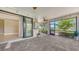 Enclosed lanai with brick flooring overlooks the beautiful backyard and lush landscaping at 1481 Hyssop Loop, North Port, FL 34289