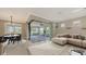 Cozy living room with sliding glass doors leading to an outdoor patio at 1481 Hyssop Loop, North Port, FL 34289