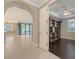 Open living space leading to a room with sliding glass doors and an outdoor patio at 1481 Hyssop Loop, North Port, FL 34289
