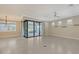 Spacious living area with sliding glass doors to the outdoor patio and lots of natural light at 1481 Hyssop Loop, North Port, FL 34289