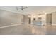 Bright, open living space with modern tile flooring leading to a well-equipped kitchen and patio at 1481 Hyssop Loop, North Port, FL 34289