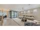 Bright living space with tile flooring, an open floor plan, and access to the outdoor patio at 1481 Hyssop Loop, North Port, FL 34289