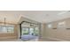 Bright, airy room featuring sliding glass doors leading to an outdoor patio area at 1481 Hyssop Loop, North Port, FL 34289
