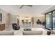 Stylish living room in an open concept layout featuring an island kitchen and dining area at 1481 Hyssop Loop, North Port, FL 34289