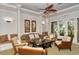 Cozy lounge area with comfortable seating, decorative artwork, and a tranquil atmosphere for relaxation at 1481 Hyssop Loop, North Port, FL 34289