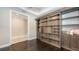 Home office featuring custom wooden built-in shelving and storage solutions at 1481 Hyssop Loop, North Port, FL 34289