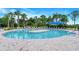 Resort-style swimming pool featuring ample seating, shade, and a sun-soaked deck at 1481 Hyssop Loop, North Port, FL 34289