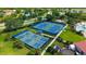 Aerial view of community tennis and pickle ball courts near neighborhood amenities at 1481 Hyssop Loop, North Port, FL 34289