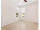 Bright bedroom with tile floors, a ceiling fan, and two windows that offer great natural light at 1493 Maseno Dr, Venice, FL 34292