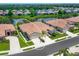 Charming attached villa with two-car garage, lush landscaping, and serene water views at 1493 Maseno Dr, Venice, FL 34292