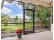 Relaxing screened lanai featuring beautiful backyard lake view and privacy at 1493 Maseno Dr, Venice, FL 34292