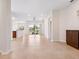 Bright and open living room featuring tile flooring, neutral paint, and sliding glass doors at 1493 Maseno Dr, Venice, FL 34292