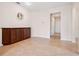 Spacious living room featuring tile flooring, a built-in cabinet, and neutral paint, creating an inviting atmosphere at 1493 Maseno Dr, Venice, FL 34292