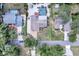 Aerial view of the property showing the house layout, nearby street, and surrounding neighborhood at 1515 Pecan St, Nokomis, FL 34275