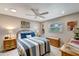 Cozy bedroom with a queen bed, soft lighting, and tasteful decor at 1515 Pecan St, Nokomis, FL 34275