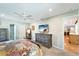 Cozy bedroom featuring ceiling fan, a dresser with mounted TV, and doorways leading to other rooms at 1515 Pecan St, Nokomis, FL 34275