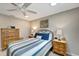 A quaint bedroom offers a comfortable space with a ceiling fan and soft decor at 1515 Pecan St, Nokomis, FL 34275