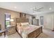 Bedroom with a queen bed, a window with natural light, and access to the en-suite bathroom at 1515 Pecan St, Nokomis, FL 34275