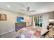 Relaxing bedroom with a sliding glass door that offers access to the pool area and a flat screen television at 1515 Pecan St, Nokomis, FL 34275