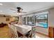 Well-lit dining area with pool views and an expansive table for entertaining at 1515 Pecan St, Nokomis, FL 34275