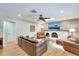 Inviting living room featuring a fireplace, wood floors, tv, and comfortable seating at 1515 Pecan St, Nokomis, FL 34275