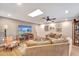 Inviting living room with a comfortable sofa, large TV, and ample natural light at 1515 Pecan St, Nokomis, FL 34275