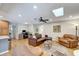 Comfortable living room with leather seating, a ceiling fan, and a workspace at 1515 Pecan St, Nokomis, FL 34275