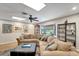 Spacious living room with a large sectional sofa, bay window, and stylish decor at 1515 Pecan St, Nokomis, FL 34275