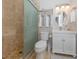 Bathroom with tiled walk-in shower, vanity with sink, and modern fixtures at 161 Suntan Ave, Sarasota, FL 34237