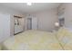 Cozy bedroom featuring a large bed, dresser with mirror, and ample closet space at 161 Suntan Ave, Sarasota, FL 34237