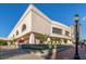 Exterior shot of a commercial building, showcasing its unique architecture and landscaping on a sunny day at 161 Suntan Ave, Sarasota, FL 34237