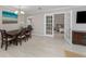 Formal dining room with wood table and chairs, decorative art and white trim at 161 Suntan Ave, Sarasota, FL 34237
