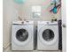 Functional laundry room featuring side-by-side Samsung washer and dryer at 161 Suntan Ave, Sarasota, FL 34237