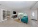 Spacious living room featuring a comfortable couch, windows and an entrance at 161 Suntan Ave, Sarasota, FL 34237