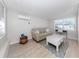 Cozy living room with a comfortable couch, white coffee table, and bright natural light at 161 Suntan Ave, Sarasota, FL 34237