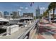 Picturesque view of the marina featuring an array of boats docked on a sunny day with city views in the background at 161 Suntan Ave, Sarasota, FL 34237