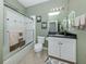 Well-maintained bathroom with shower, vanity, and neutral decor, offering a relaxing space at 165 Tiziano Way, North Venice, FL 34275