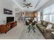 Open-concept living area featuring a kitchen with breakfast bar and comfortable seating at 165 Tiziano Way, North Venice, FL 34275