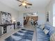 Spacious living area features tile floors, stylish furnishings and views of the kitchen and breakfast nook at 165 Tiziano Way, North Venice, FL 34275