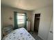 Cozy bedroom features a nautical-themed bedspread and a window with natural light at 202 Mantua Dr, Venice, FL 34285