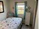 Cozy bedroom with lots of natural light and a nautical theme at 202 Mantua Dr, Venice, FL 34285