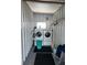 Functional laundry room featuring a washer, dryer, and utility sink at 202 Mantua Dr, Venice, FL 34285
