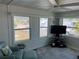 Bright living room features a large window and comfortable seating at 202 Mantua Dr, Venice, FL 34285