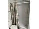 Shower features a white fiberglass stall and nautical-themed shower curtain at 202 Mantua Dr, Venice, FL 34285
