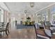 Elegant clubhouse interior featuring hardwood floors, high ceilings, designer lighting, and stylish furnishings at 21649 Avon Park Ct, Venice, FL 34293